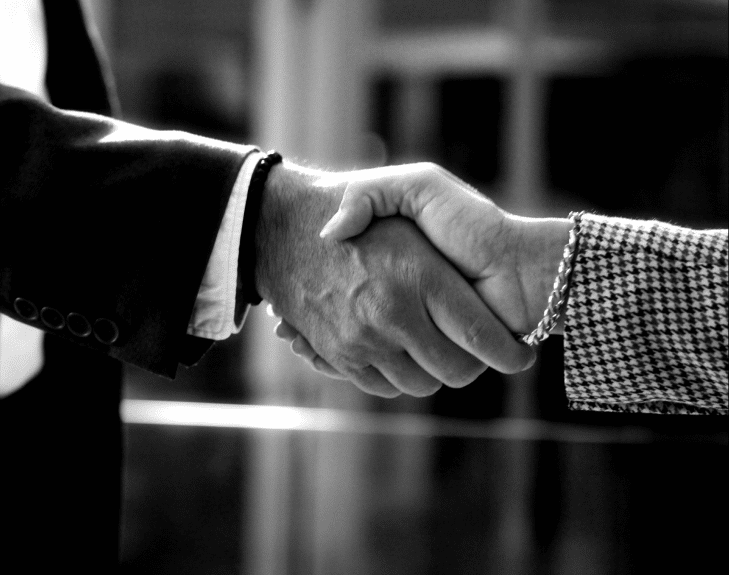 Two business leaders shaking hands